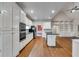 Spacious kitchen with ample storage, stainless steel appliances, and a center island at 9395 Clublands Dr, Alpharetta, GA 30022