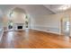Open living room with hardwood floors, fireplace, and lots of natural light at 9395 Clublands Dr, Alpharetta, GA 30022