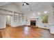 Vaulted living room with fireplace and custom built-in bookshelves at 9395 Clublands Dr, Alpharetta, GA 30022