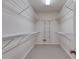 Walk-in closet with shelving for optimal storage of clothing, shoes and personal items at 9395 Clublands Dr, Alpharetta, GA 30022
