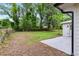 Expansive backyard with lush greenery, a well-maintained lawn, and white siding at 2026 Rebecca Ln, Decatur, GA 30032