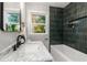Bathroom featuring a marble countertop and a tiled shower at 2026 Rebecca Ln, Decatur, GA 30032