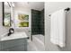 Bathroom featuring a vanity with marble countertop and a tiled shower at 2026 Rebecca Ln, Decatur, GA 30032