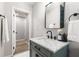Bathroom featuring a vanity with marble countertop and modern black fixtures at 2026 Rebecca Ln, Decatur, GA 30032