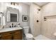 Bathroom featuring a modern vanity with stone countertop and a tiled walk-in shower at 2026 Rebecca Ln, Decatur, GA 30032