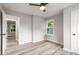 Bedroom with two windows, light gray walls, and wood-look floors at 2026 Rebecca Ln, Decatur, GA 30032