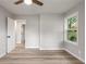 Neutral bedroom with wood-look floors and a view to the outdoors at 2026 Rebecca Ln, Decatur, GA 30032