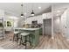 Spacious kitchen featuring a central island with seating, modern fixtures, and an open layout at 2026 Rebecca Ln, Decatur, GA 30032