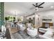 Open concept living space seamlessly connects the living room, dining area, and kitchen for modern living at 2026 Rebecca Ln, Decatur, GA 30032