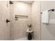Modern tiled shower with built-in shelving and matte black fixtures at 2026 Rebecca Ln, Decatur, GA 30032