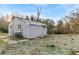 Image of a backyard with a concrete patio and painted brick facade at 2211 Macon Sw Dr, Atlanta, GA 30315