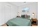 Bedroom features luxury vinyl plank flooring and two windows, allowing natural light at 2211 Macon Sw Dr, Atlanta, GA 30315
