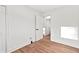 A well-lit bedroom offers luxury vinyl plank flooring and an adjacent room view at 2211 Macon Sw Dr, Atlanta, GA 30315