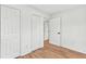Bedroom featuring luxury vinyl plank flooring and multiple closets for storage at 2211 Macon Sw Dr, Atlanta, GA 30315
