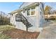 Charming home featuring gray brick, newly painted stairs, and a inviting front entry at 2211 Macon Sw Dr, Atlanta, GA 30315
