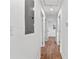 Long hallway leads to rooms with consistent luxury vinyl plank flooring at 2211 Macon Sw Dr, Atlanta, GA 30315
