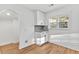 A bright kitchenette provides ample cabinet space, granite countertops, and a view outside at 2211 Macon Sw Dr, Atlanta, GA 30315