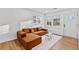 Bright living room featuring an appealing brown sofa and plenty of natural light at 2211 Macon Sw Dr, Atlanta, GA 30315