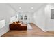 Bright living room showcases a comfortable brown sofa and plenty of natural light at 2211 Macon Sw Dr, Atlanta, GA 30315