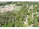 An elevated view showing the property amongst a lush, green neighborhood near a school at 3078 Alberta Dr, Marietta, GA 30062