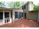 An exterior shot of the rear of the house showing the deck and screened porch at 3078 Alberta Dr, Marietta, GA 30062