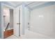 Bright white tiled bathroom with shower over tub at 3078 Alberta Dr, Marietta, GA 30062