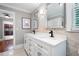 Bathroom featuring a double vanity, modern fixtures, and decorative mirrors at 3078 Alberta Dr, Marietta, GA 30062