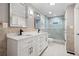 Bathroom showcasing a double vanity, modern fixtures, and a tiled walk-in shower at 3078 Alberta Dr, Marietta, GA 30062