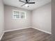 A cozy bedroom featuring wood-look floors, natural light, and neutral walls create a relaxing atmosphere at 3078 Alberta Dr, Marietta, GA 30062