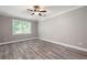 Bright bedroom with modern flooring, neutral walls, and large window at 3078 Alberta Dr, Marietta, GA 30062
