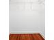 Walk-in closet featuring hardwood floors and metal hanging racks at 3078 Alberta Dr, Marietta, GA 30062
