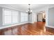 A bright dining room featuring hardwood floors and elegant chandelier lighting at 3078 Alberta Dr, Marietta, GA 30062