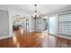 A well-lit dining area showcasing hardwood floors and open access to other living spaces at 3078 Alberta Dr, Marietta, GA 30062