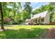 Charming home with a covered front porch, two-car garage, and lush greenery surrounding the property at 3078 Alberta Dr, Marietta, GA 30062