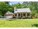Charming home featuring a covered front porch, well-manicured lawn and an attached two car garage at 3078 Alberta Dr, Marietta, GA 30062