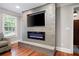 Modern fireplace with electric insert and mounted television adding warmth and style to the living space at 3078 Alberta Dr, Marietta, GA 30062