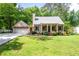 Charming home with a well-manicured lawn, a cozy front porch, and an attached garage at 3078 Alberta Dr, Marietta, GA 30062