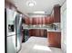 Kitchen features stainless steel refrigerator, granite countertops, custom cabinets, and stainless steel appliances at 3078 Alberta Dr, Marietta, GA 30062
