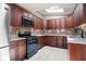 Kitchen features granite countertops, custom cabinets, stainless steel appliances and a skylight at 3078 Alberta Dr, Marietta, GA 30062