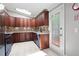 Open kitchen with custom wood cabinets, granite countertops, stainless steel appliances, and door to exterior at 3078 Alberta Dr, Marietta, GA 30062