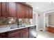 Modern kitchen featuring stainless steel appliances, granite countertops, and sleek dark wood cabinets at 3078 Alberta Dr, Marietta, GA 30062
