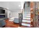 Open foyer with wood staircase and living room view featuring a fireplace and modern decor at 3078 Alberta Dr, Marietta, GA 30062