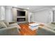 Contemporary living room featuring a fireplace, hardwood floors, and comfortable seating at 3078 Alberta Dr, Marietta, GA 30062