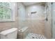 Walk-in shower with a glass door, bench, and pebble stone shower floor at 3078 Alberta Dr, Marietta, GA 30062