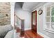 Elegant staircase with wood and iron railings and natural stone accents at 3078 Alberta Dr, Marietta, GA 30062