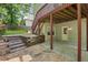 Outdoor area features a covered patio and steps leading to upper deck at 4140 Lansfaire Ter, Suwanee, GA 30024