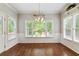 Bright dining room with hardwood floors, large windows and elegant trim at 4140 Lansfaire Ter, Suwanee, GA 30024
