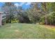 A spacious backyard with healthy green grass, framed by mature trees to create a private outdoor oasis at 2113 Dodson Woods Dr, Fairburn, GA 30213