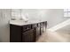 Bathroom featuring large vanity with dual sinks, ample countertop space, and dark wood cabinets at 2113 Dodson Woods Dr, Fairburn, GA 30213