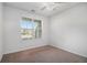 Minimalist bedroom with carpet, natural light, and ceiling fan at 2113 Dodson Woods Dr, Fairburn, GA 30213